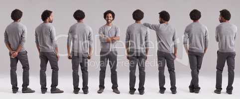 I choose to be happy today. Studio shot of a confident man standing out from a group of clones.