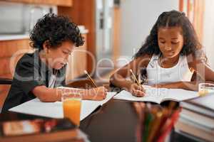 Encourage your child to think independently. Shot of a sister and brother doing their homework together.