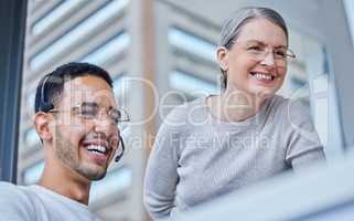 One more tweak and your work will be perfect. Shot of a male businessman with his female boss in his office.