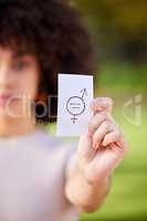 Protest against injustices. Shot of a young woman holding a card in protest in a park.