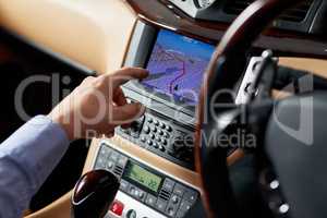 Let technology lead the way. Closeup shot of a driver using a cars GPS to find directions.