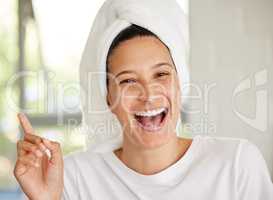 I dont do anything fancy, I just moisturise. Shot of a beautiful young woman applying moisturiser to her face.