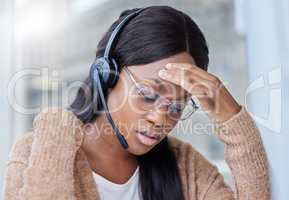 Im so stressed about this deadline. Shot of a businesswoman suffering with a migraine at her desk in her office.