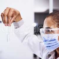 Advancing medical science. Shot of a young scientist working in a lab.