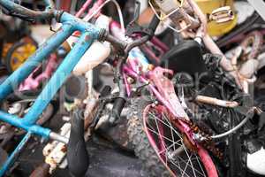 Discarded and forgotten. Closeup shot of old bicycles in a rubbish heap.