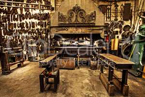 Traditional workshop for a traditional craft. Shot of a metal craftsmans workshop filled with metal tools.