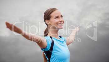 Ah, feeling good and enjoying the crisp air. Shot of a young woman training outdoors with her arms outstretched.