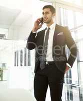 Influence the word of mouth about your business. Shot of a businessman talking on his cellphone in an office.
