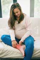 Pregnancy can be an extremely stressful time.... Shot of a pregnant woman at home.