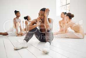 Be there for them when they come through. Studio shot of a young ballet dancer having a stressful day in a dance studio.