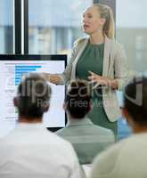How do we improve our metrics. Shot of a young businesswoman giving a presentation at work.