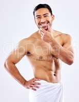 This body deserves praise. Shot of a man posing in his underwear against a white studio background.