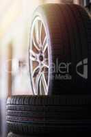 Wheels and tyres. Closeup shot of a pile of car tyres.