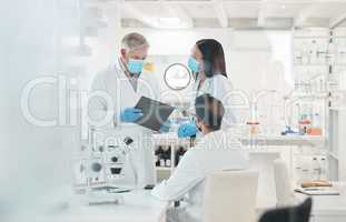 Problem solving is what they do best. Shot of a group of scientists working together in a lab.