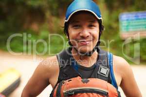 Im ready to hit the water. Cropped portrait of a handsome young man standing outside before going white water rafting.
