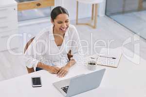 All guys, whipping on my charm for all eyes. Shot of a businesswoman on a video call in a modern office.