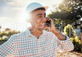An agricultural life is one eminently calculated for human happiness. Shot of a young man talking on a cellphone while working on a farm.