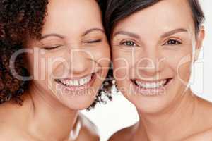 Beauty is happiness. Cropped shot of two beautiful mature women posing against a grey background in studio.