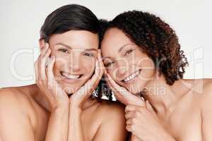 This skincare regime is working for us. Cropped portrait of two beautiful mature women posing against a grey background in studio.