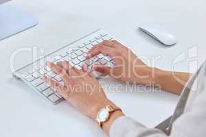 Compiling the last of her reports. Closeup shot of an unrecognisable businesswoman working on a computer in an office.