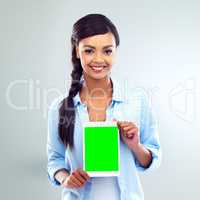 Look what I found online. Shot of a young woman presenting a digital tablet over a grey background.