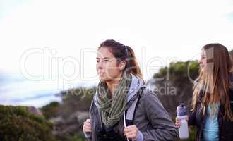 Hiking with a good friend. Shot of two attractive young female hikers outdoors.