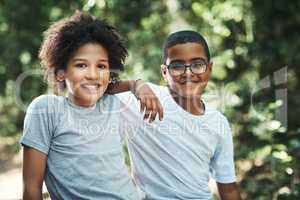 Best buds make summer camp even better. Shot of two teenage boys exploring nature at summer camp.