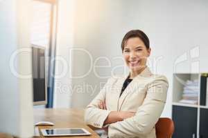 I owe my success to self confidence. Portrait of a confident businesswoman working at her desk.