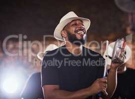 Its time to move and groove. Shot of a young musician performing with his band.