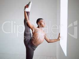 Ballet changed my outlook on life. Shot of a young boy practicing his routine in a dance studio.