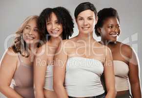 Well be together until the very end. Shot of a diverse group of women standing close together in the studio and posing.