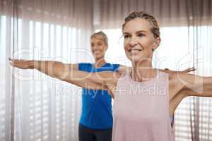 You wont see her beauty, you dont deserve to. Shot of two mature women exercising together at home.