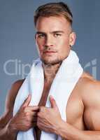 My skin is healthy and protected against dryness. Shot of a handsome young man posing with a towel around his neck.