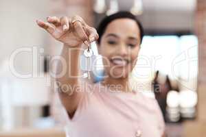 My brand new nest is just the best. Shot of a young woman holding up the keys to her new home.