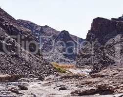 Take the road less traveled. Shot of rugged desert terrain.