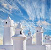 Colahonda - the beautiful coastal city of Andalusia, Spain. Beautiful chimneys and ventilation tubes in the city of Colahonda, Andalusia, Spain.