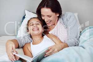 This is the best story. Cropped shot of a mother and daughter reading a bedtime story together.