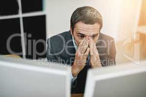 I messed up so badly. Shot of a mature businessman looking stressed out at his desk.