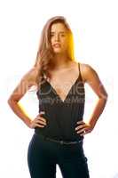 Be bold, be confident. Studio portrait of an attractive young woman standing against a brightly lit background.