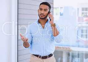 Look we need to discuss our project. Shot of a young businessman using his smartphone to make a phone call.