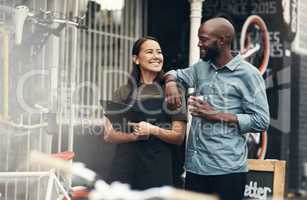 I couldnt have asked for a better teammate. Shot of two young business owners standing outside their bicycle shop during the day.