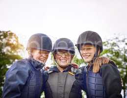 An equestrian team is more like family. Portrait of a group of young friends going horseback riding outside.