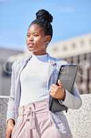 Your goals are never unattainable. Shot of a young businesswoman taking a break to daydream.