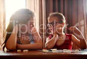 You know that Im going to win, right. Shot of two little girls playing a board game.