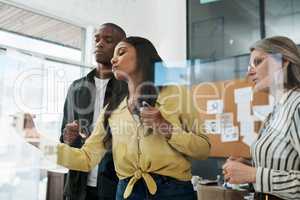 Solution to wealth disparity is not a faster train, focus. Shot of a group of businesspeople brainstorming in a modern office.