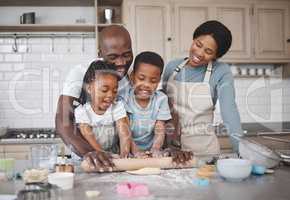 Baking is like painting or writing a song. Shot of a family baking together in the kitchen.