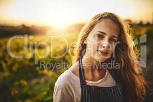 The farm life is for me. Portrait of a young woman working on a farm.