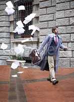 Its not going to be his day.... A businessman unaware that as he walks to work hes losing all his papers.