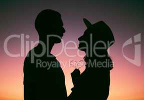 From my heart to yours. Cropped shot of an affectionate young couple silhouetted at sunset.