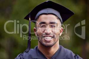 Go confidently in the direction of your dreams. Portrait of a young man looking happy on graduation day.